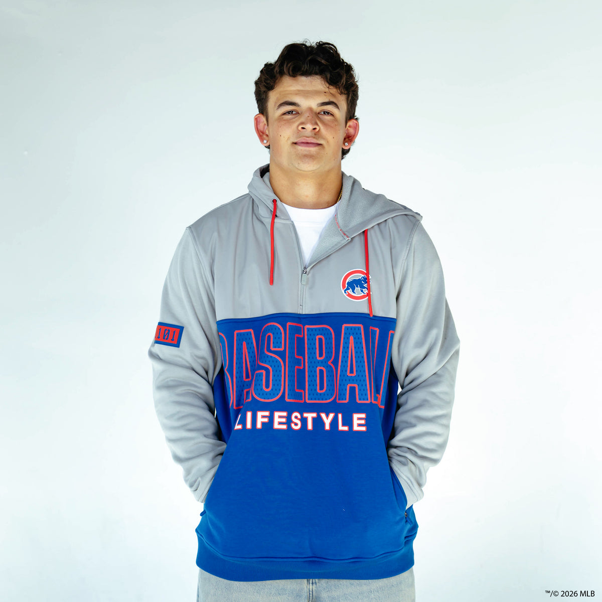 Adult model wearing blue Chicago Cubs Color Block quarter zip