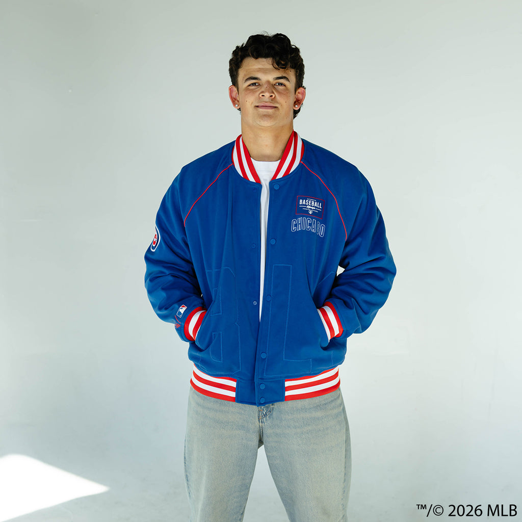 Adult model wearing blue Chicago Cubs Stadium bomber jacket