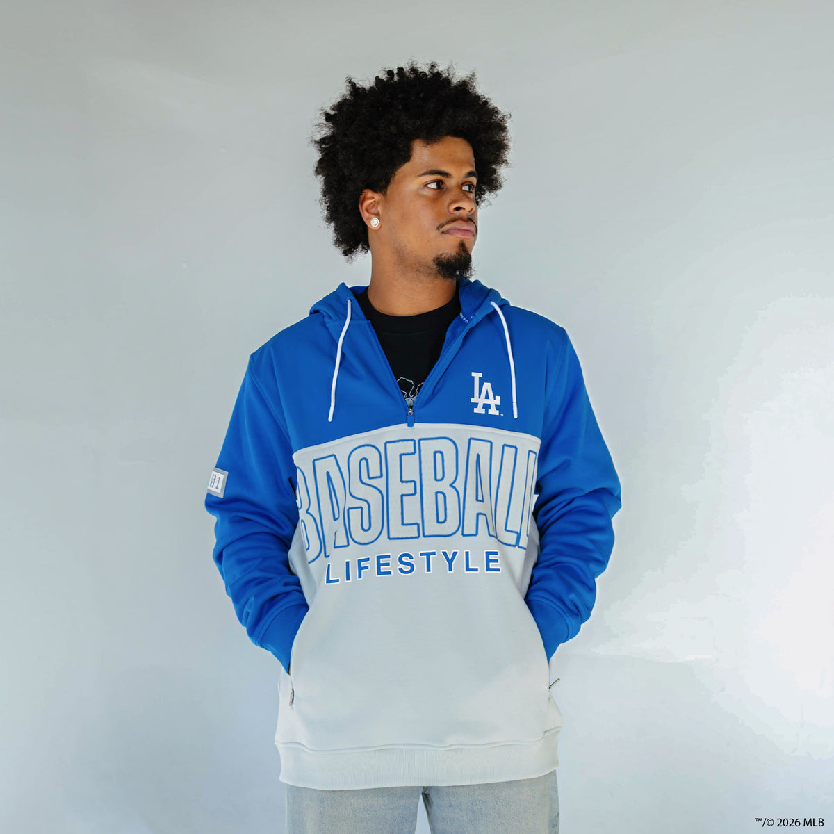Adult model wearing blue Los Angeles Dodgers Color Block quarter zip