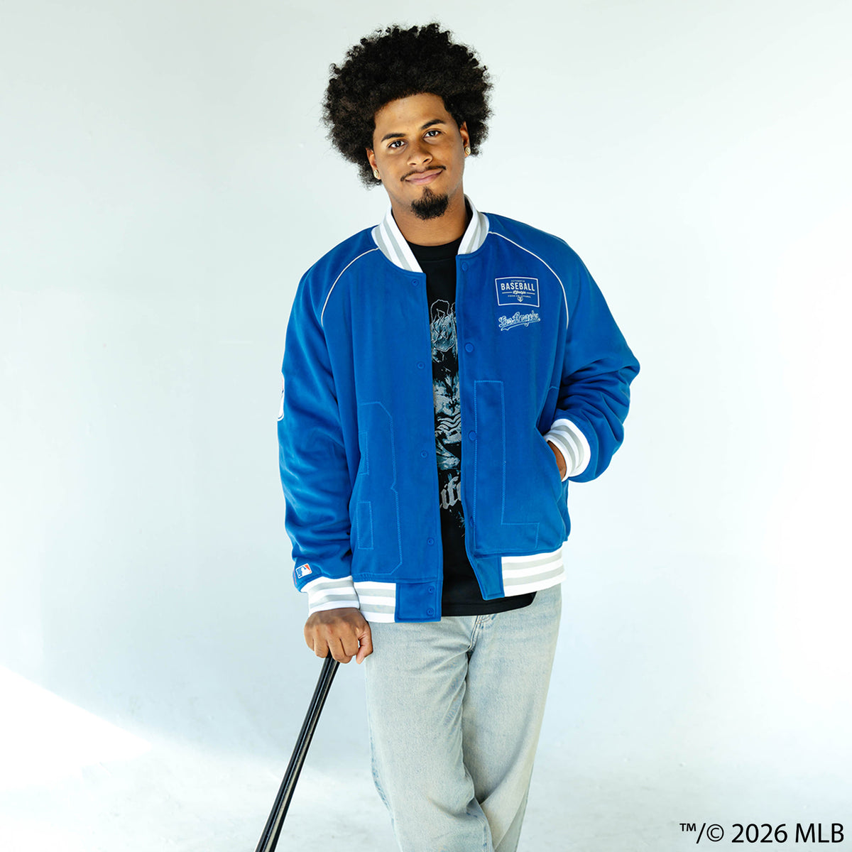 Adult model wearing blue Los Angeles Dodgers Stadium bomber jacket