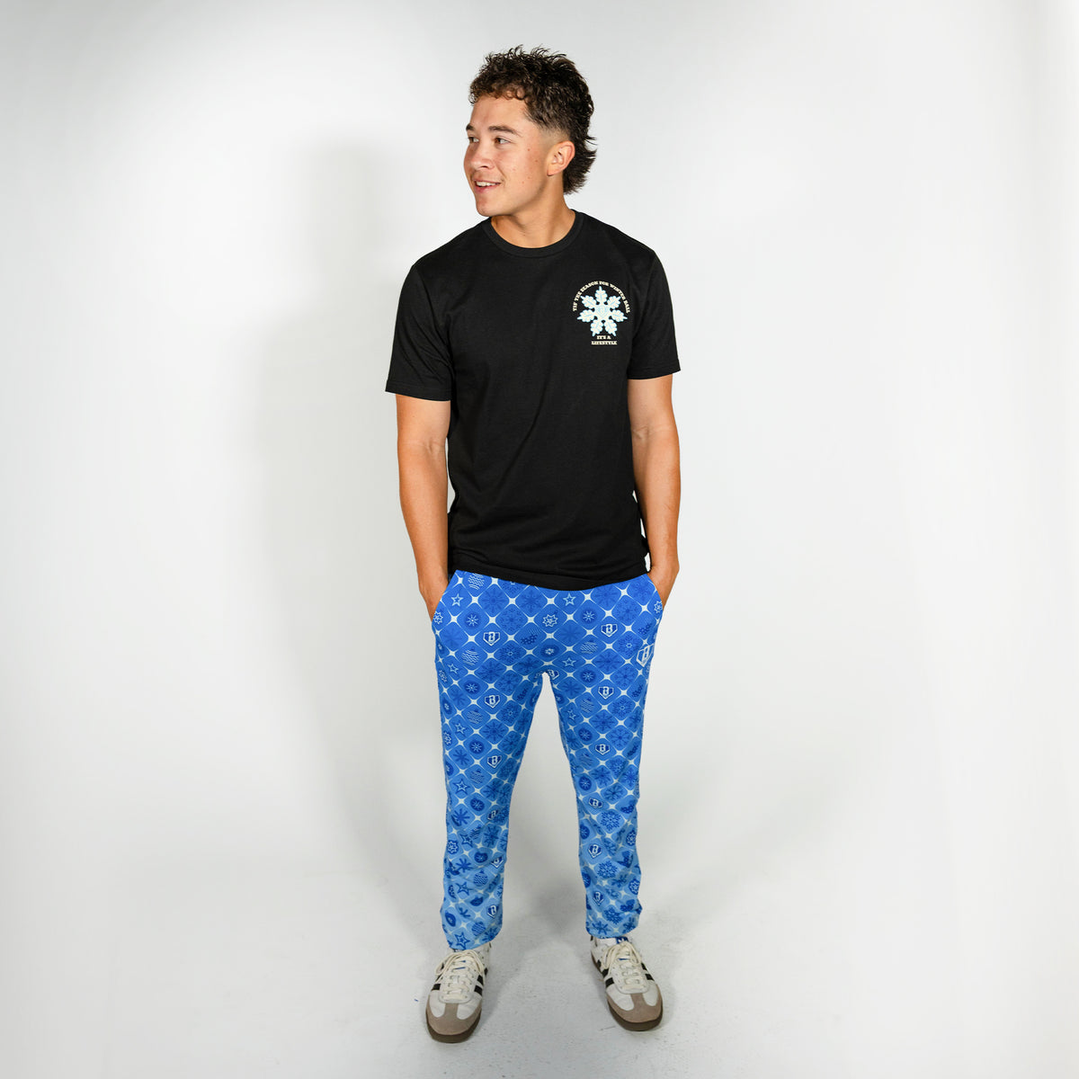 Adult model wearing blue pajama pants with "Frozen Diamond" design