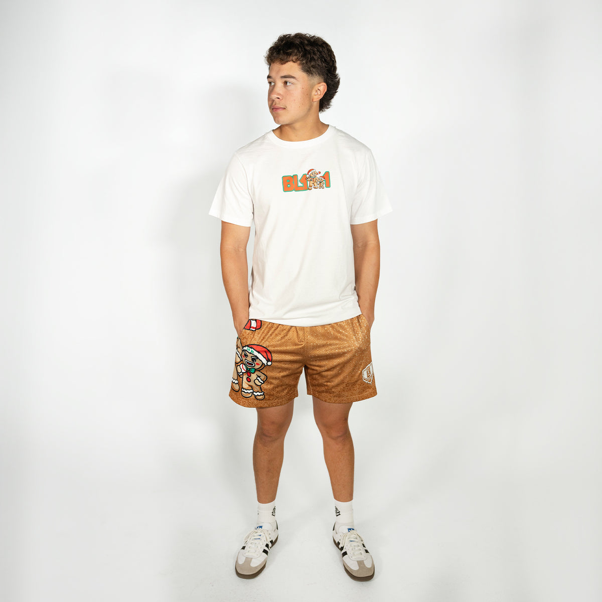 Adult model wearing brown shorts with "Gingerbread Rookie" design