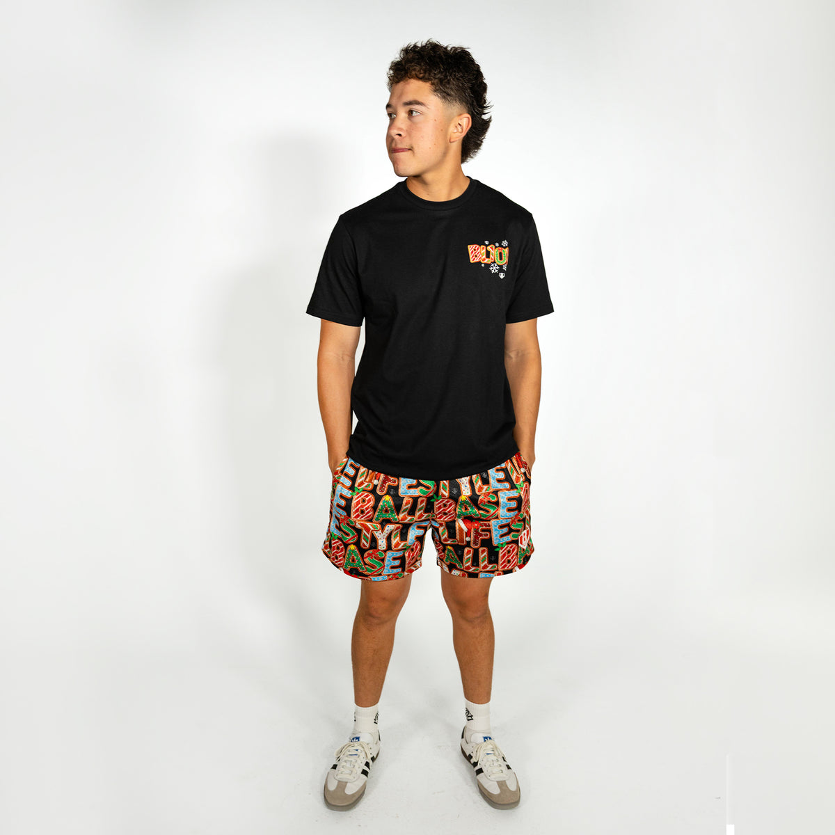 Adult model wearing multi-color shorts with "Holiday Cookie" design