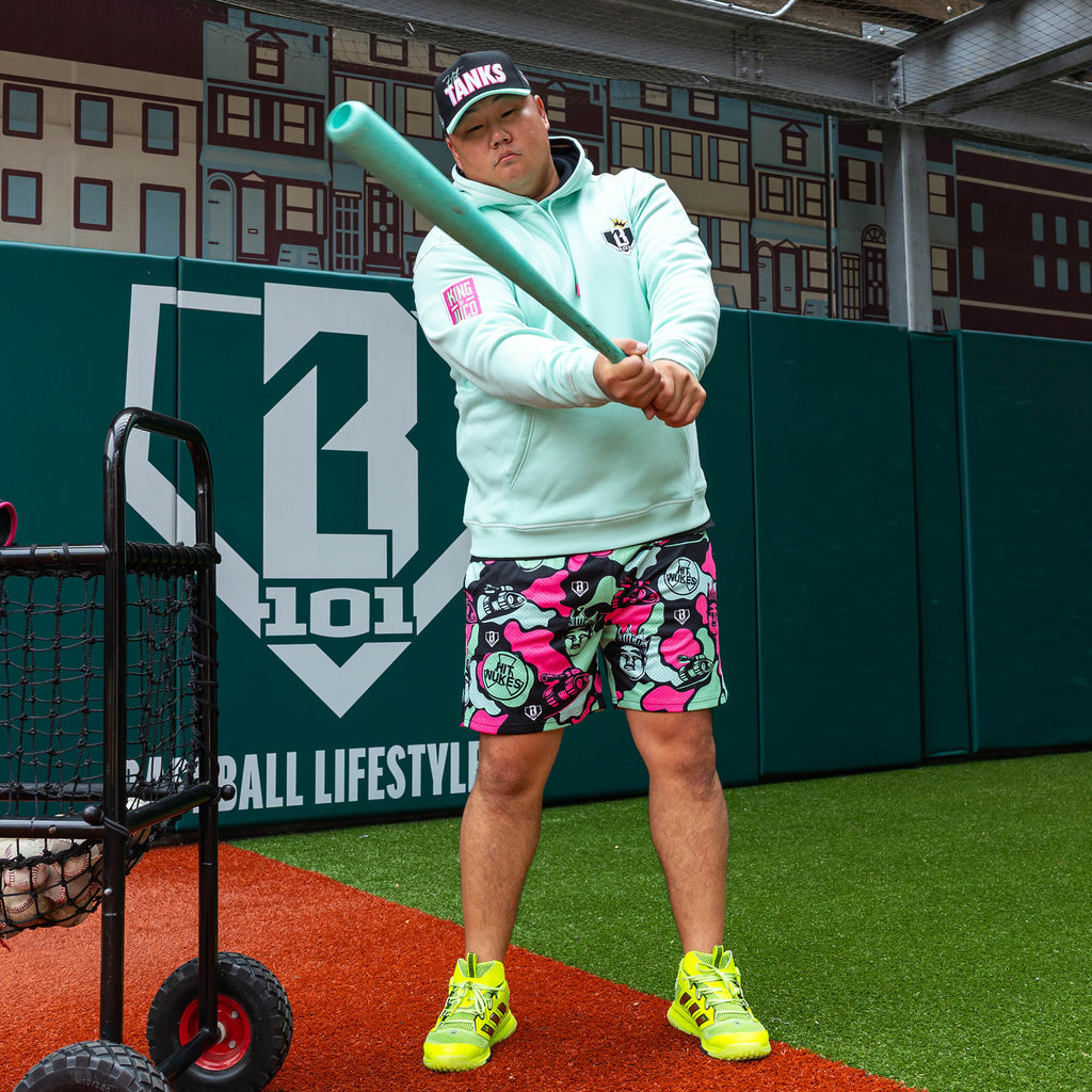 Adult model wearing teal hoodie with "King Of JUCO" design