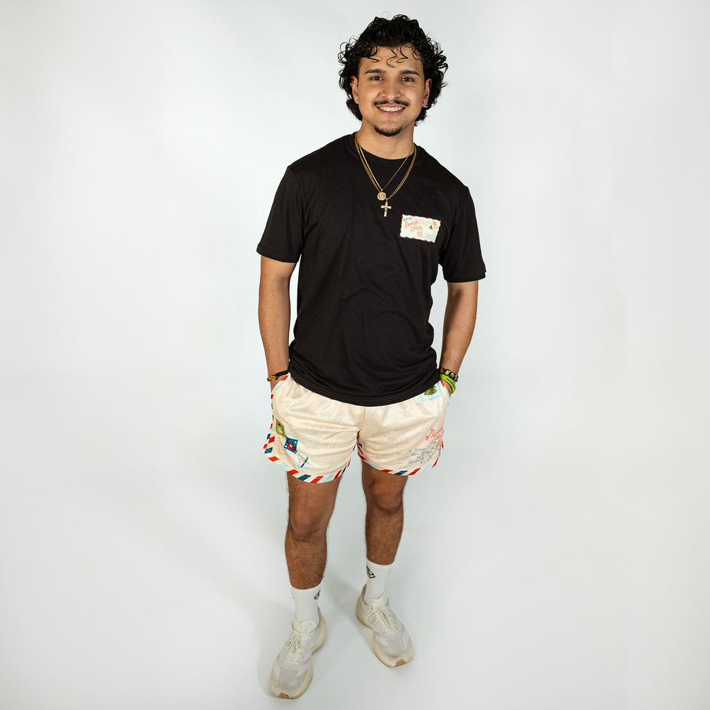 Adult model wearing white shorts with "Letter To Santa" design