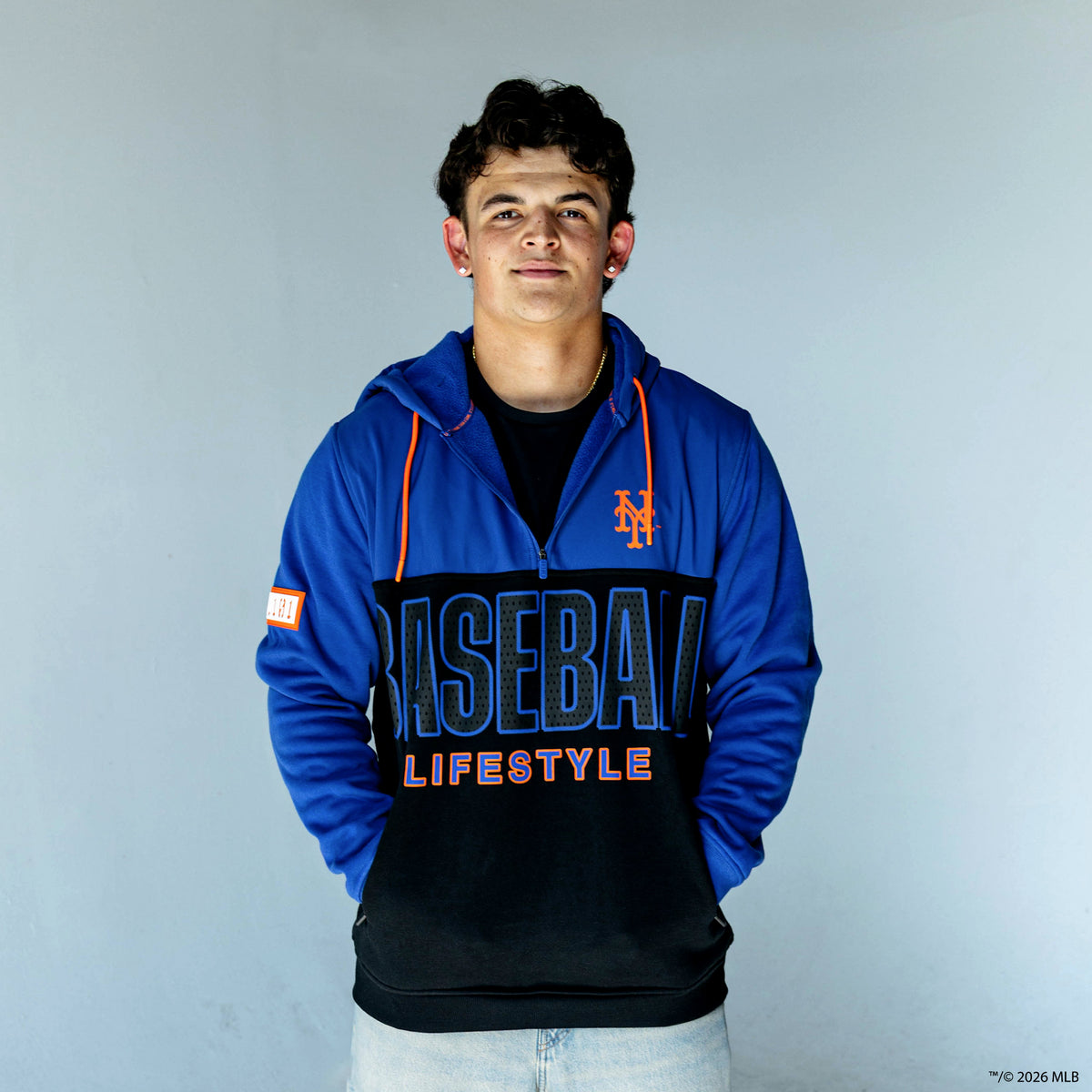 Adult model wearing blue New York Mets Color Block quarter zip