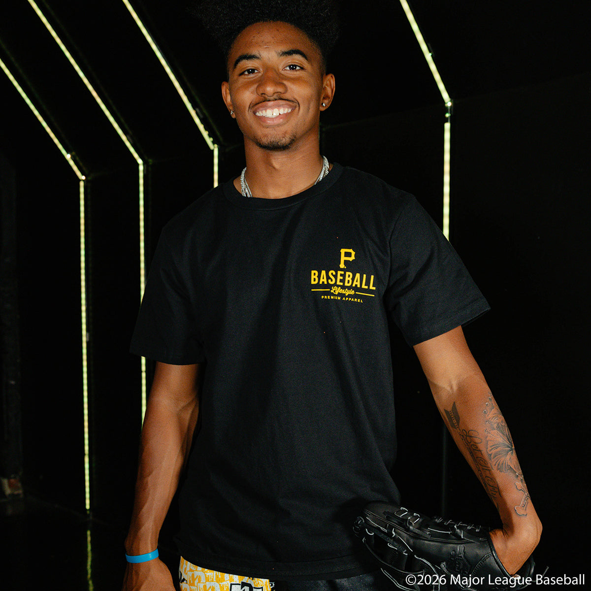 Adult model wearing black graphic tee with "Pittsburgh Pirates Ice Cream Cap" design