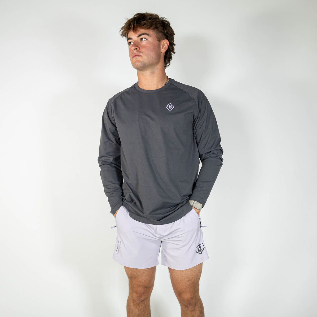 Adult model wearing gray and lilac Diamond Tech long sleeve