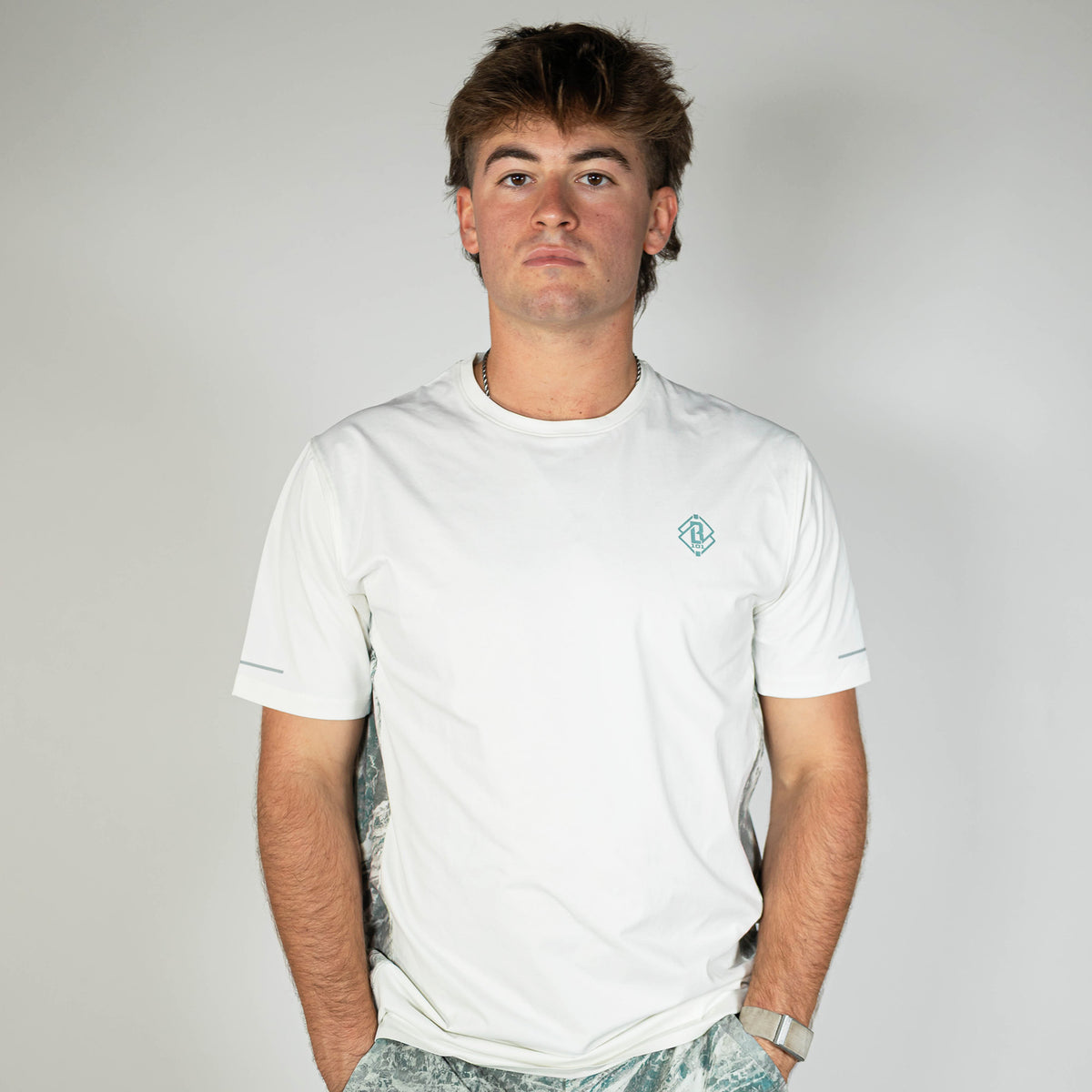 Adult model wearing white Realtree Aspect Diamond Tech Camo vented tee