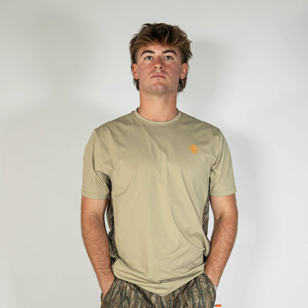 Adult model wearing brown Realtree Legacy Diamond Tech Camo vented tee