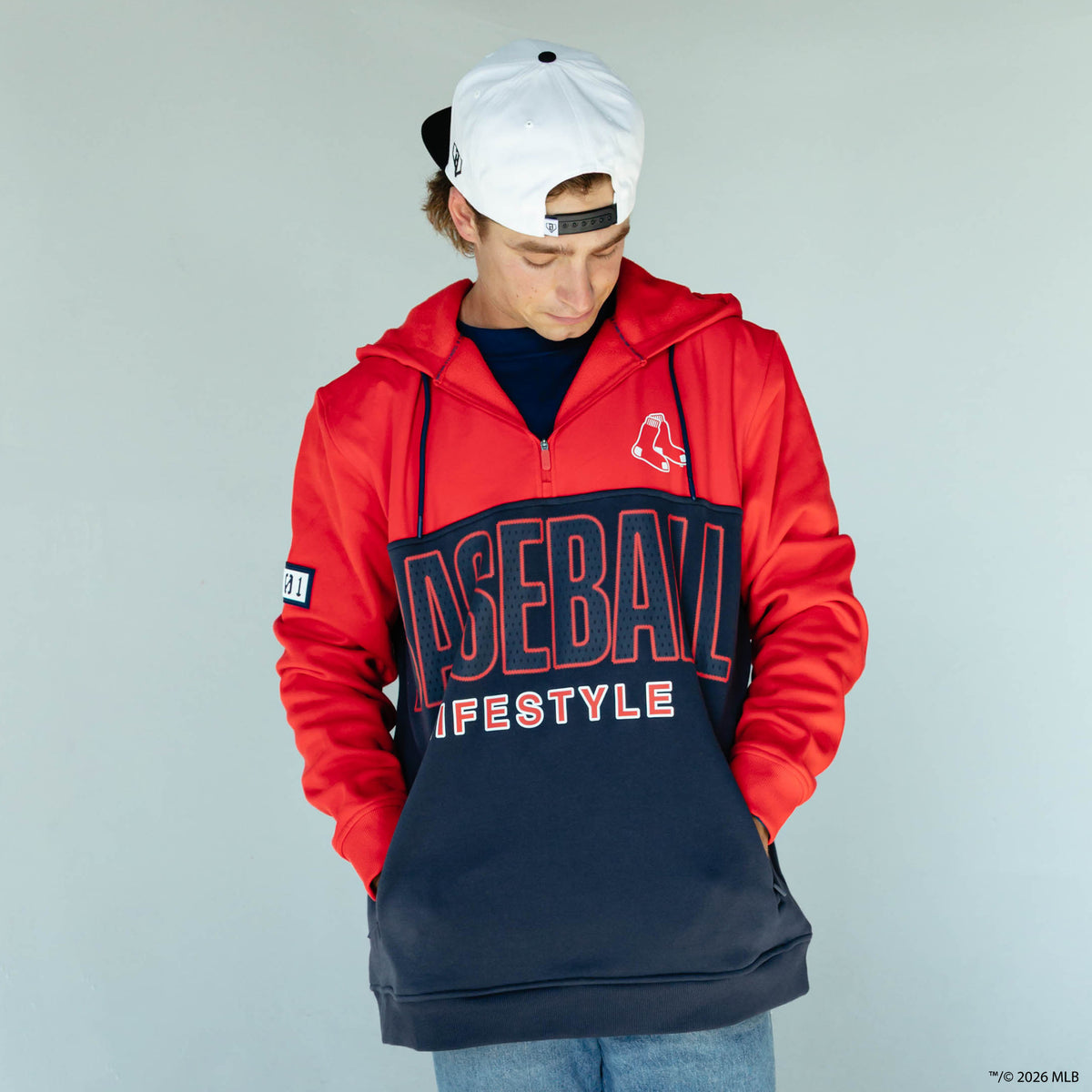 Adult model wearing red Boston Red Sox Color Block quarter zip