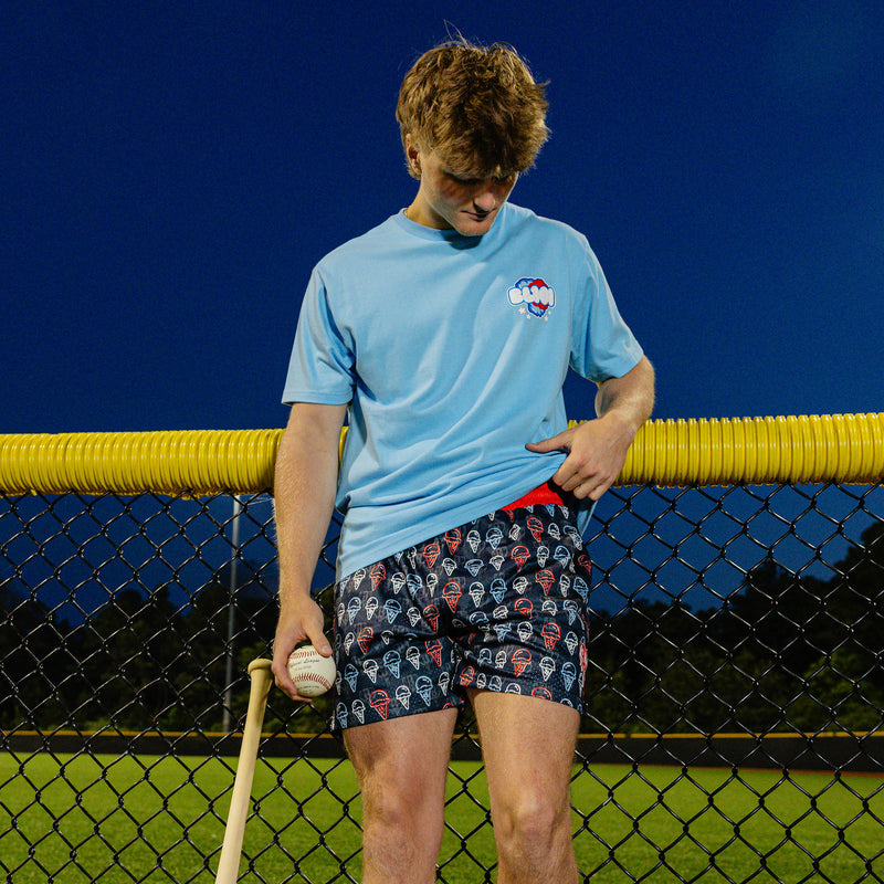 Adult model wearing red, white & blue Scoops Ice Cream shorts