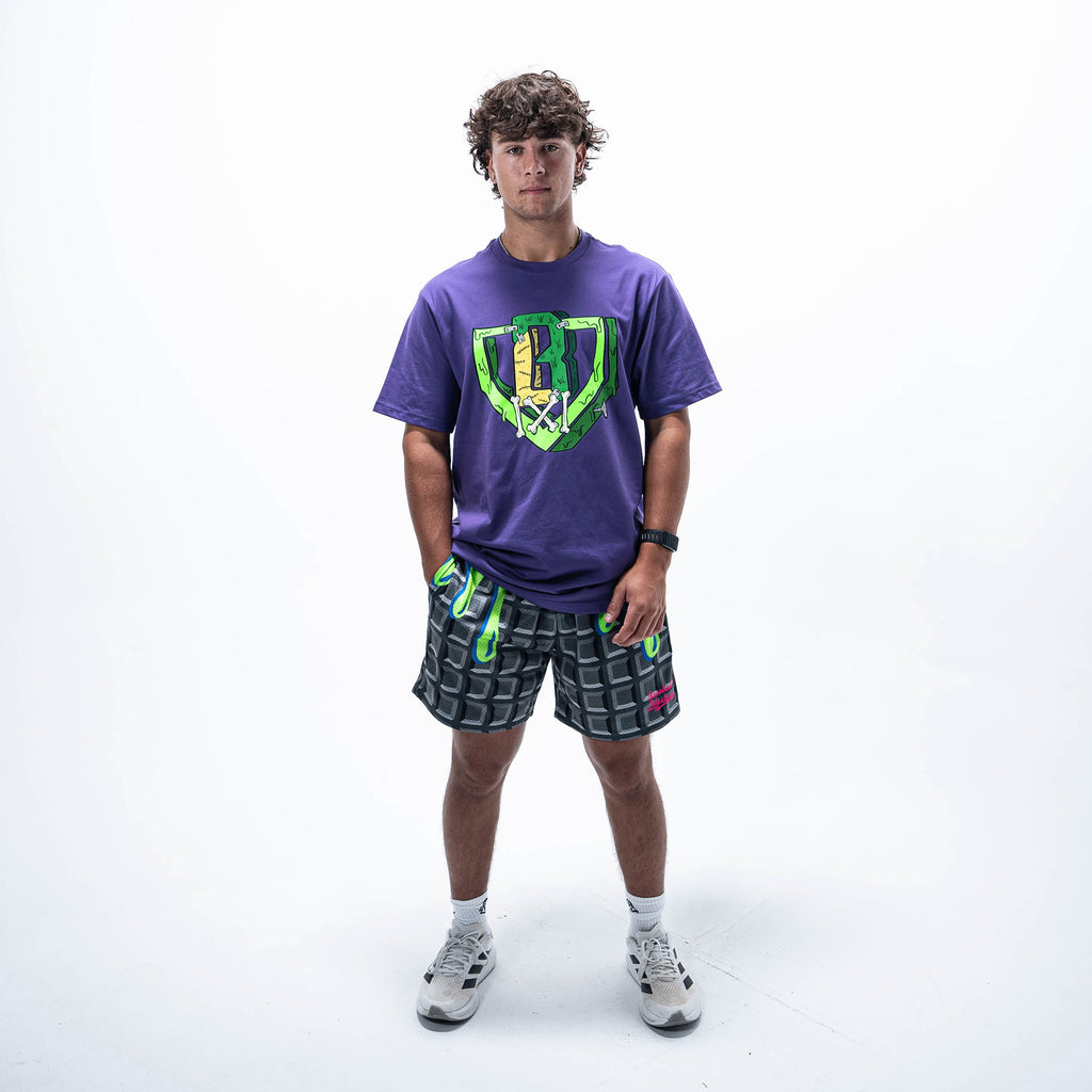Adult model wearing black shorts with "Spooky SZN Waffle" design