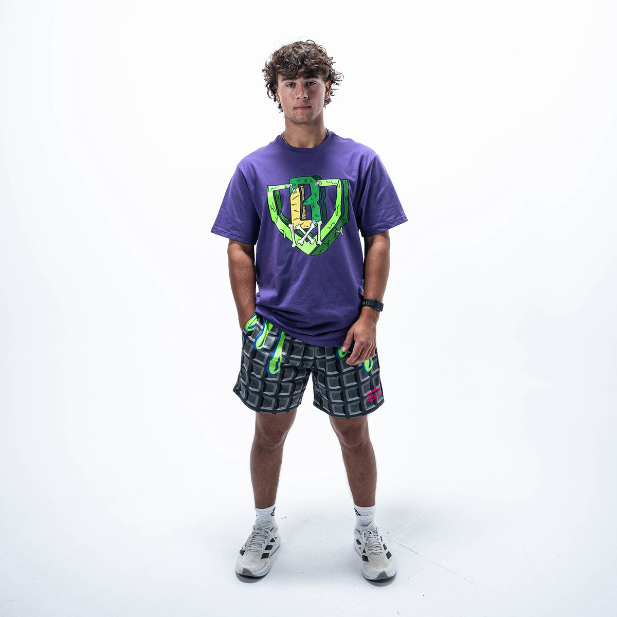 Adult model wearing black shorts with "Spooky SZN Waffle" design