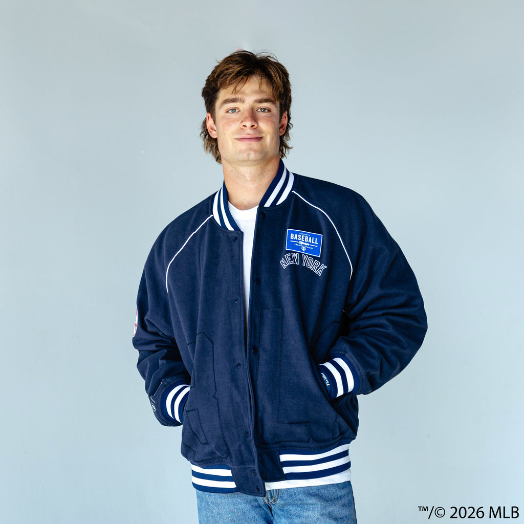 Adult model wearing navy New York Yankees Stadium bomber jacket