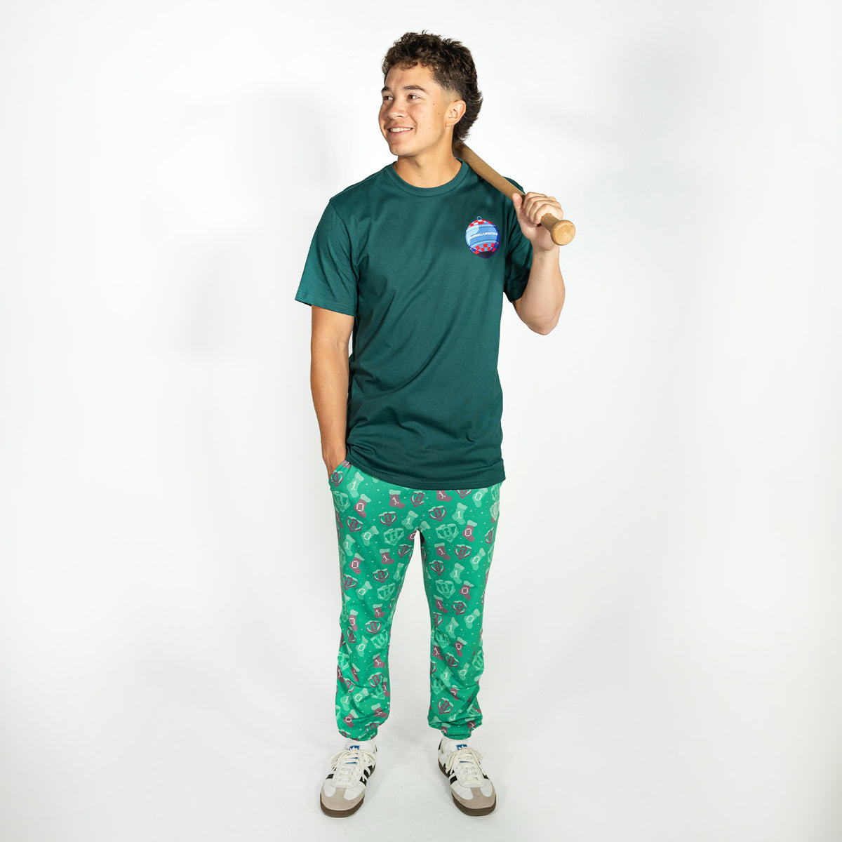 Adult model wearing green Stitched For The SZN pajama pants