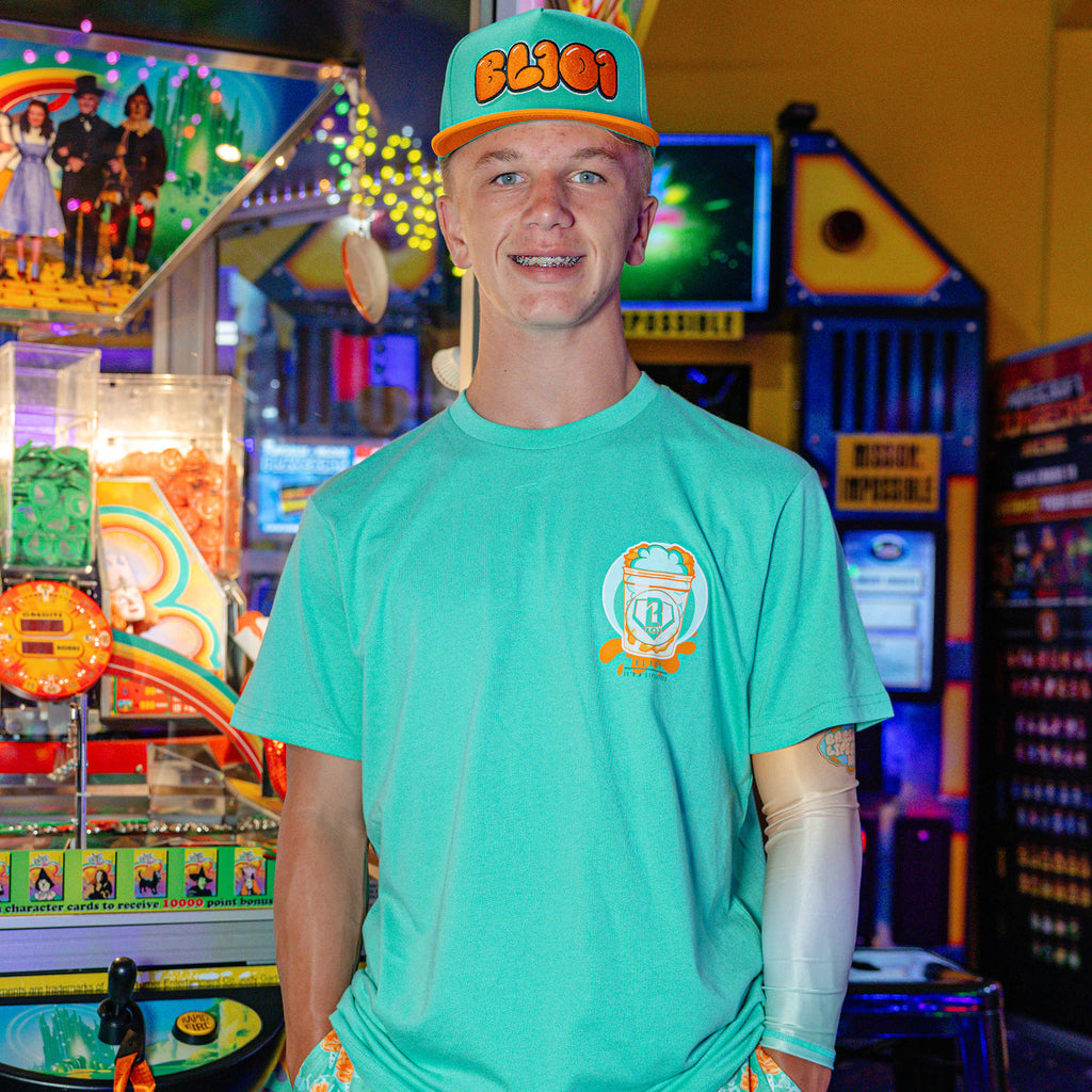 Adult model wearing Sweet Spot Tangerine Freeze graphic tee