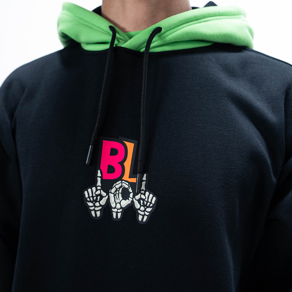 Adult model wearing black hoodie with "101 Skeleton" design