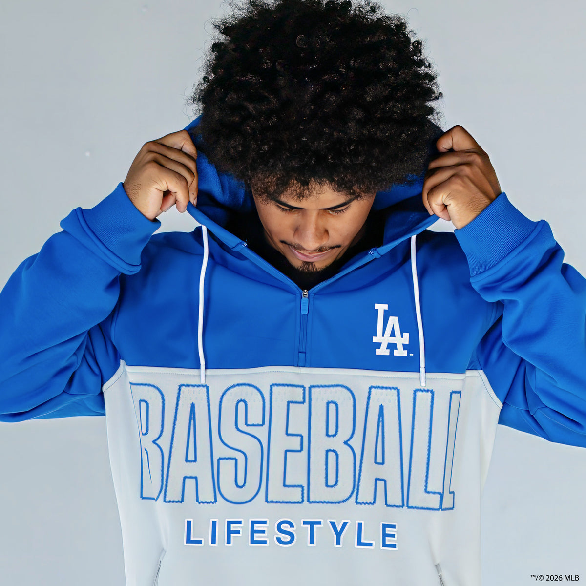 Adult model wearing blue Los Angeles Dodgers Color Block quarter zip
