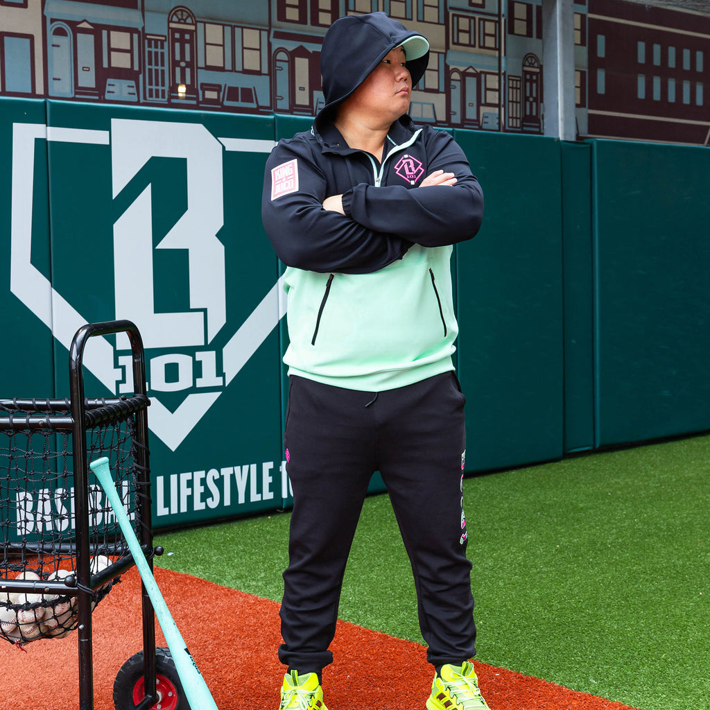 Adult model wearing black relaxed fit joggers with "King Of JUCO Diamond" design