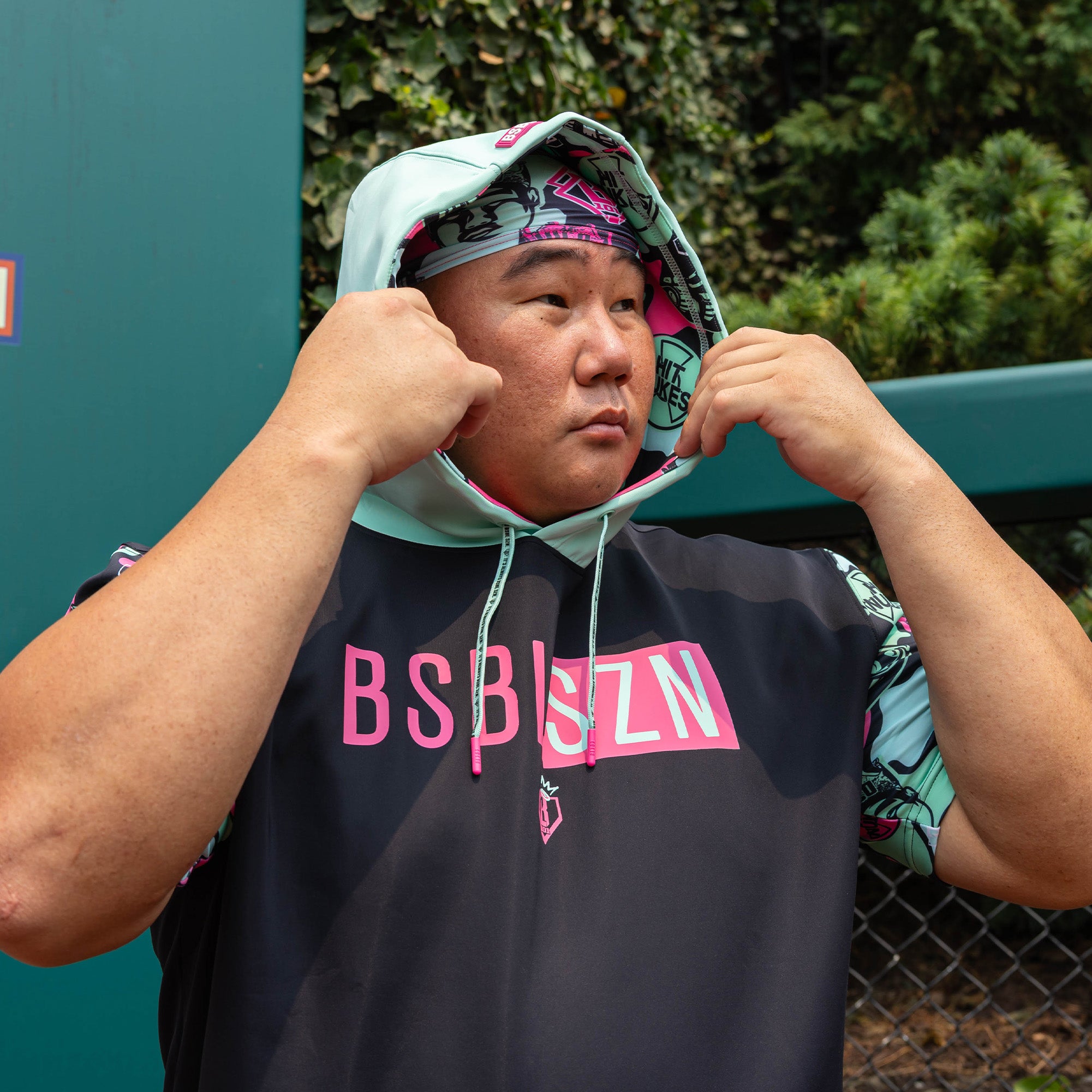 Adult model wearing black headband with "King of JUCO" design