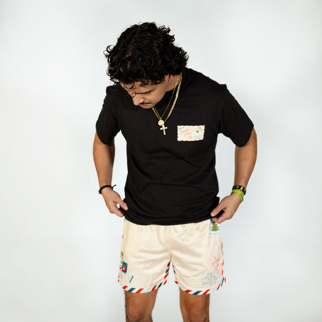 Adult model wearing white shorts with "Letter To Santa" design