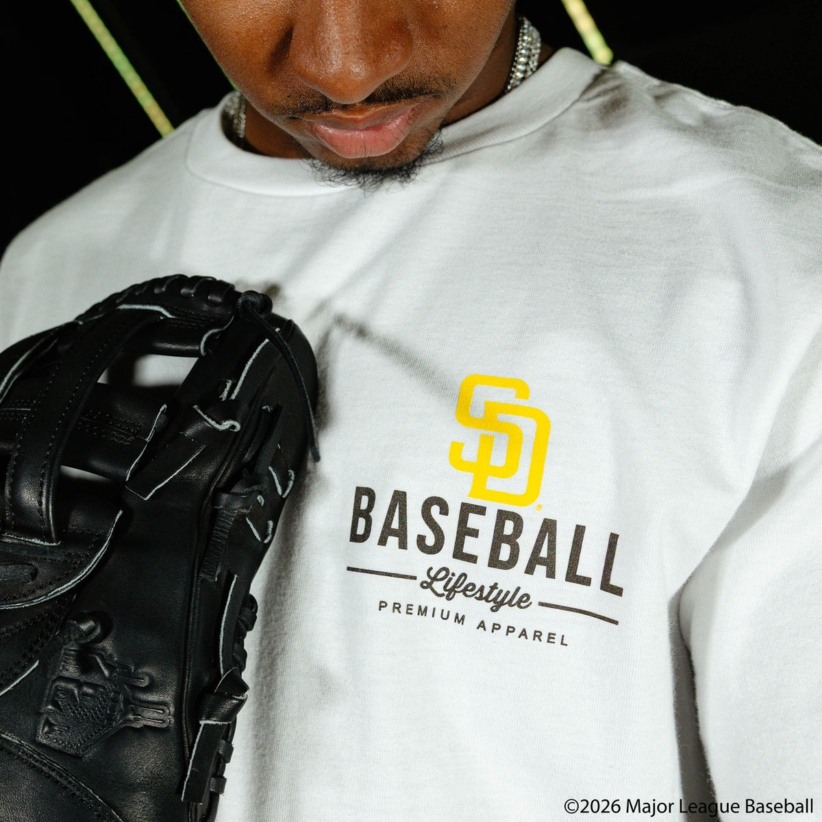 Adult model wearing white graphic tee with "San Diego Padres Ice Cream Cap" design