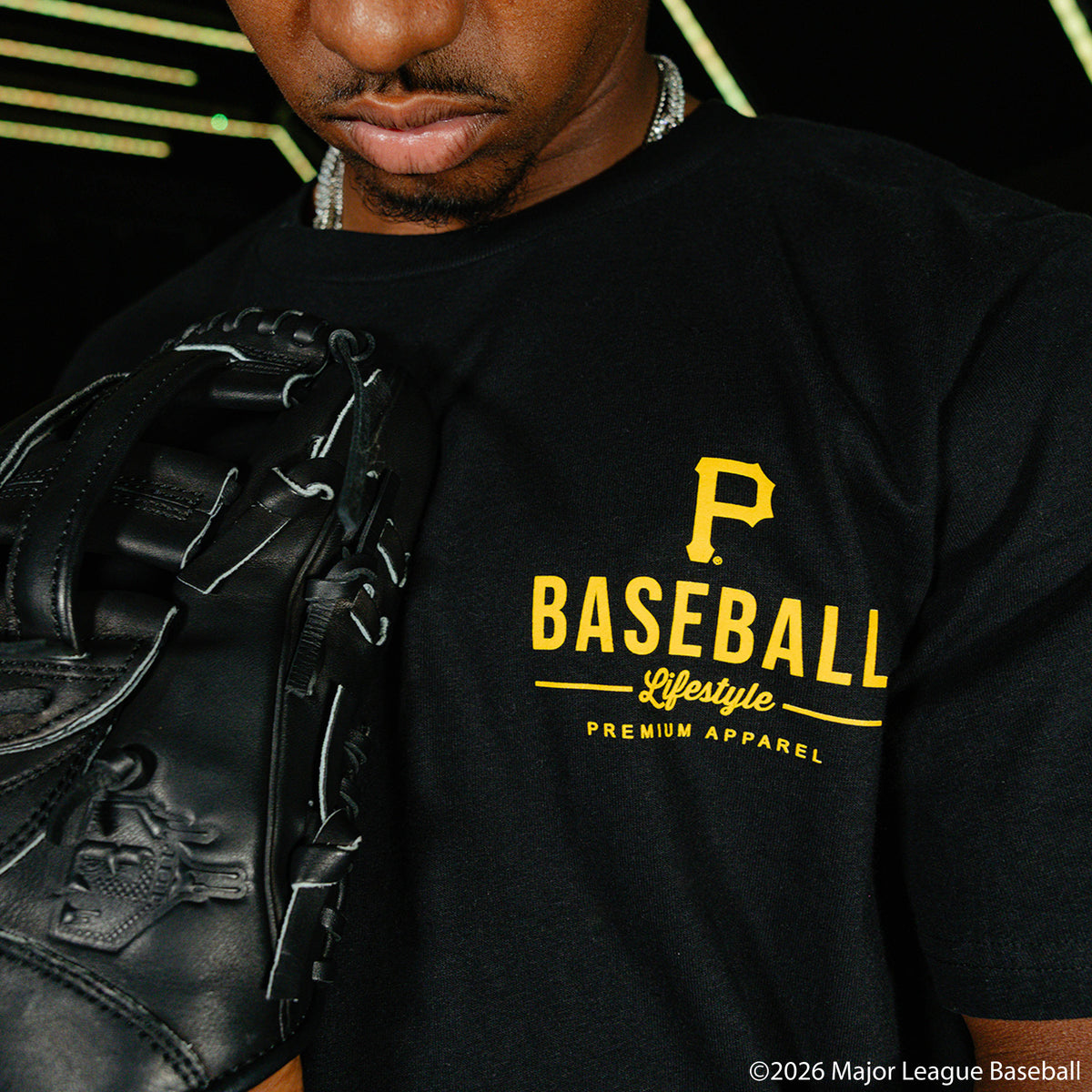Adult model wearing black graphic tee with "Pittsburgh Pirates Ice Cream Cap" design
