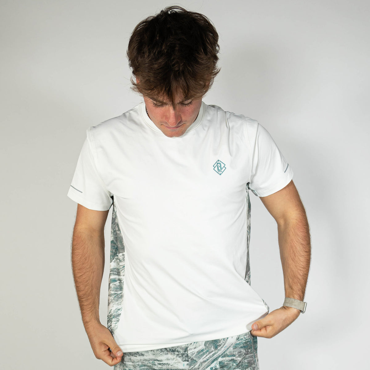 Adult model wearing white Realtree Aspect Diamond Tech Camo vented tee