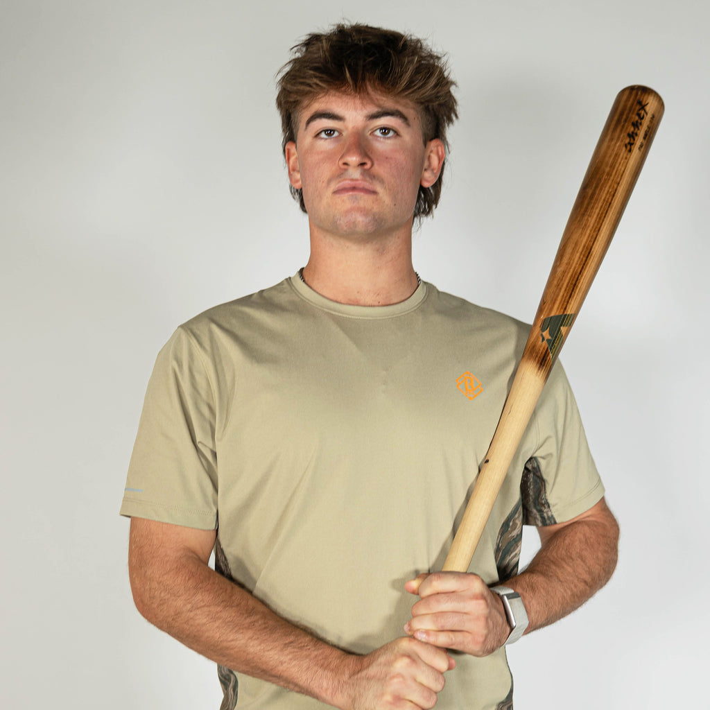 Adult model wearing brown Realtree Legacy Diamond Tech Camo vented tee