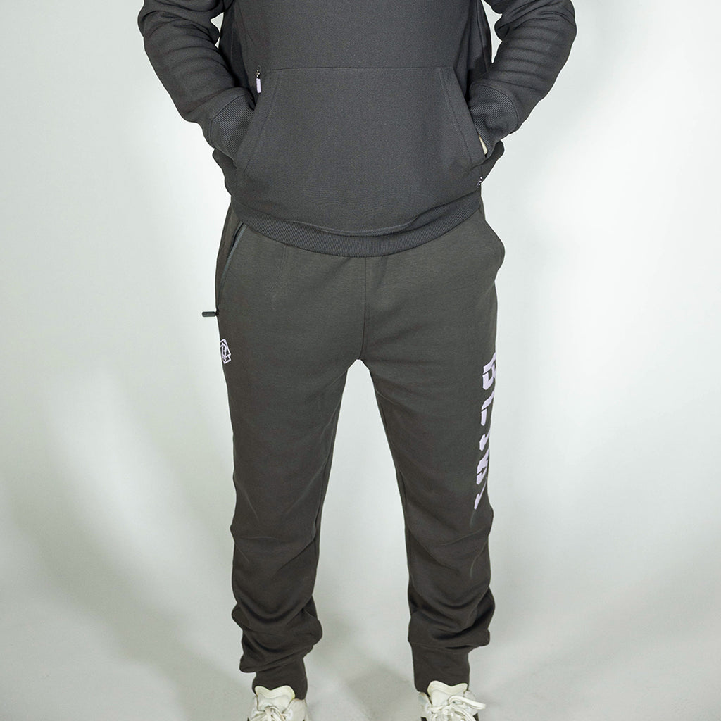 Adult model wearing gray and lilac Diamond Relaxed Fit joggers