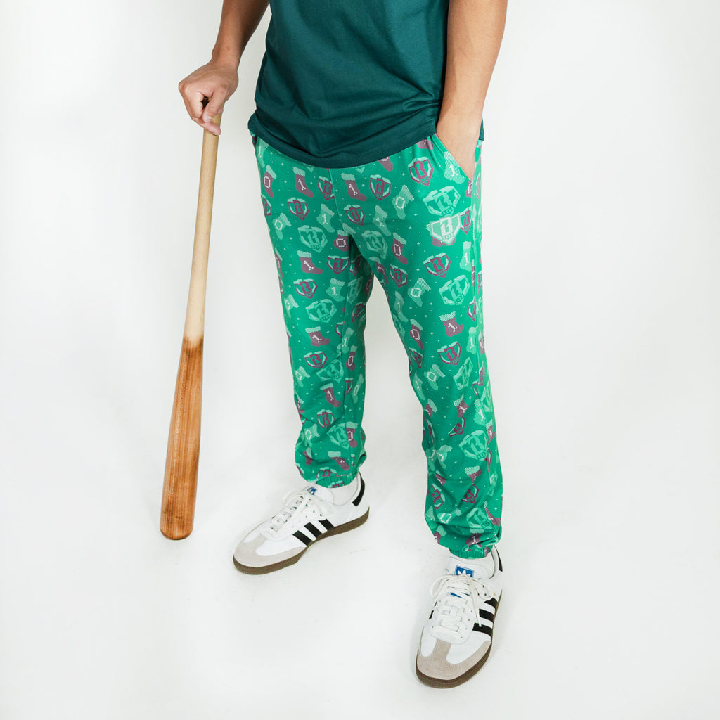 Adult model wearing green Stitched For The SZN pajama pants