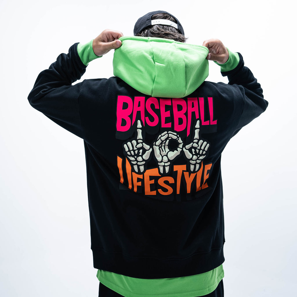 Adult model wearing black hoodie with "101 Skeleton" design