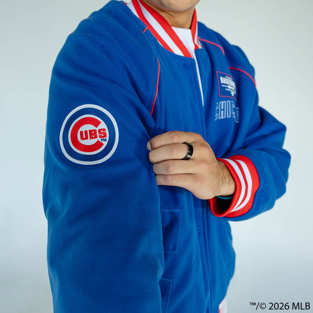 Adult model wearing blue Chicago Cubs Stadium bomber jacket