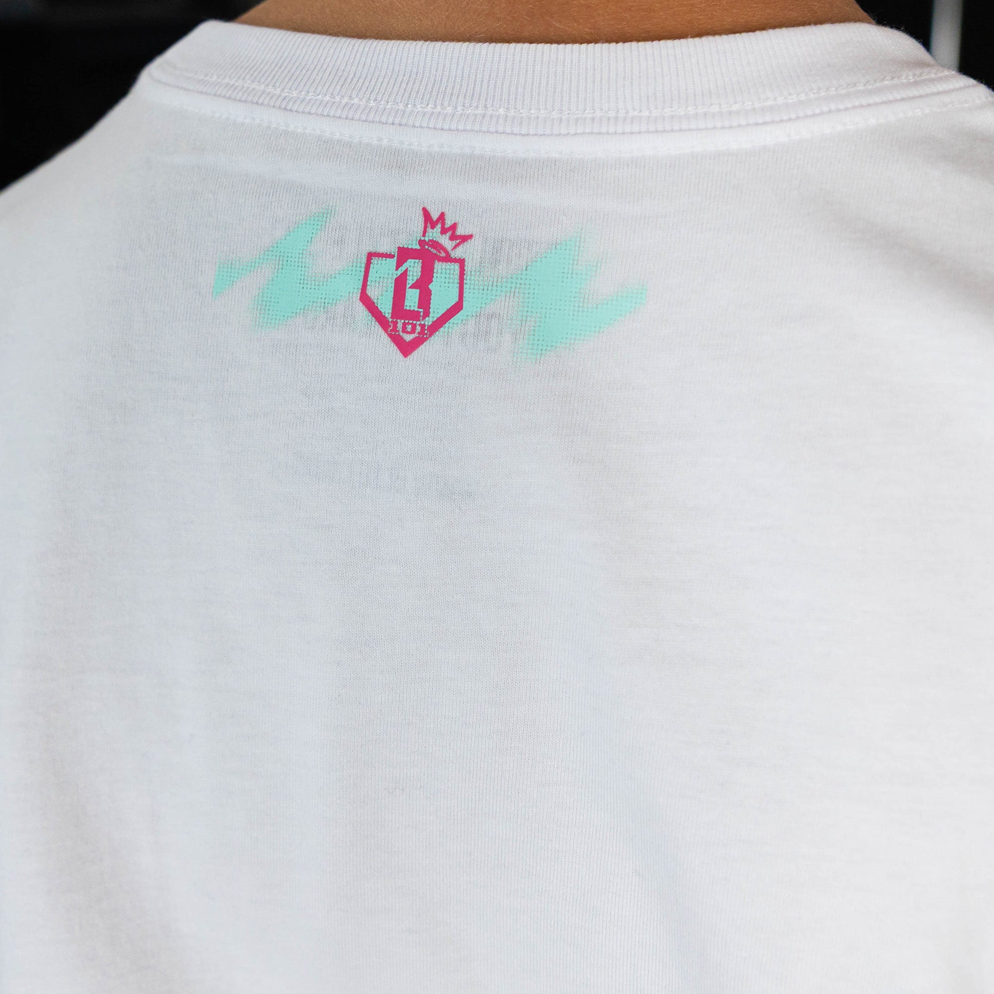 Adult model wearing white graphic tee with "Hit Tanks" design