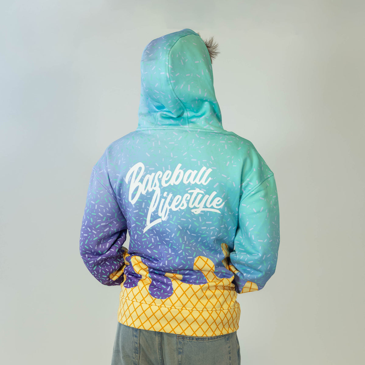 Adult model wearing multi-color Ice Cream Galaxy Grape hoodie with "Ice Cream" design