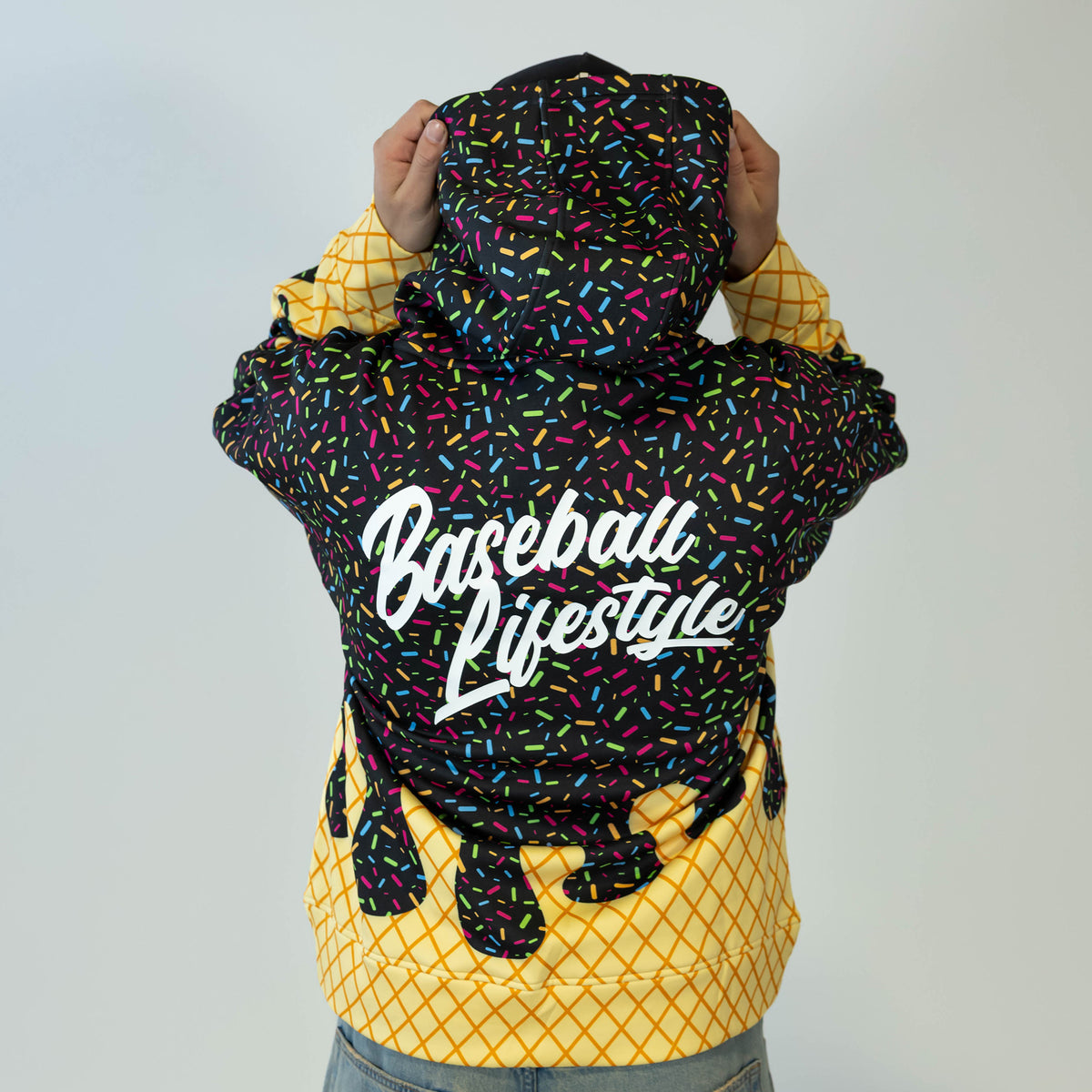 Adult model wearing black Ice Cream Midnight Sundae hoodie with "Ice Cream" design