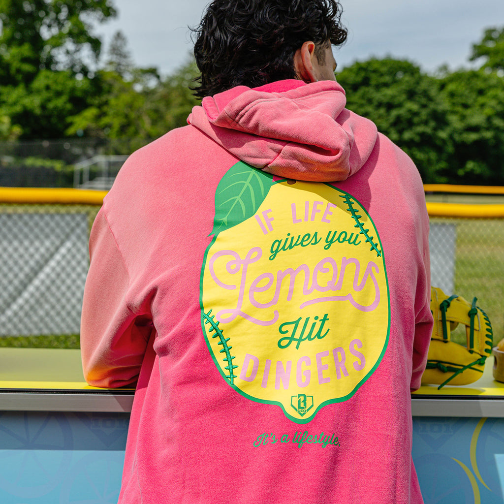 Adult model wearing pink hoodie with "Lemon Dingers" design