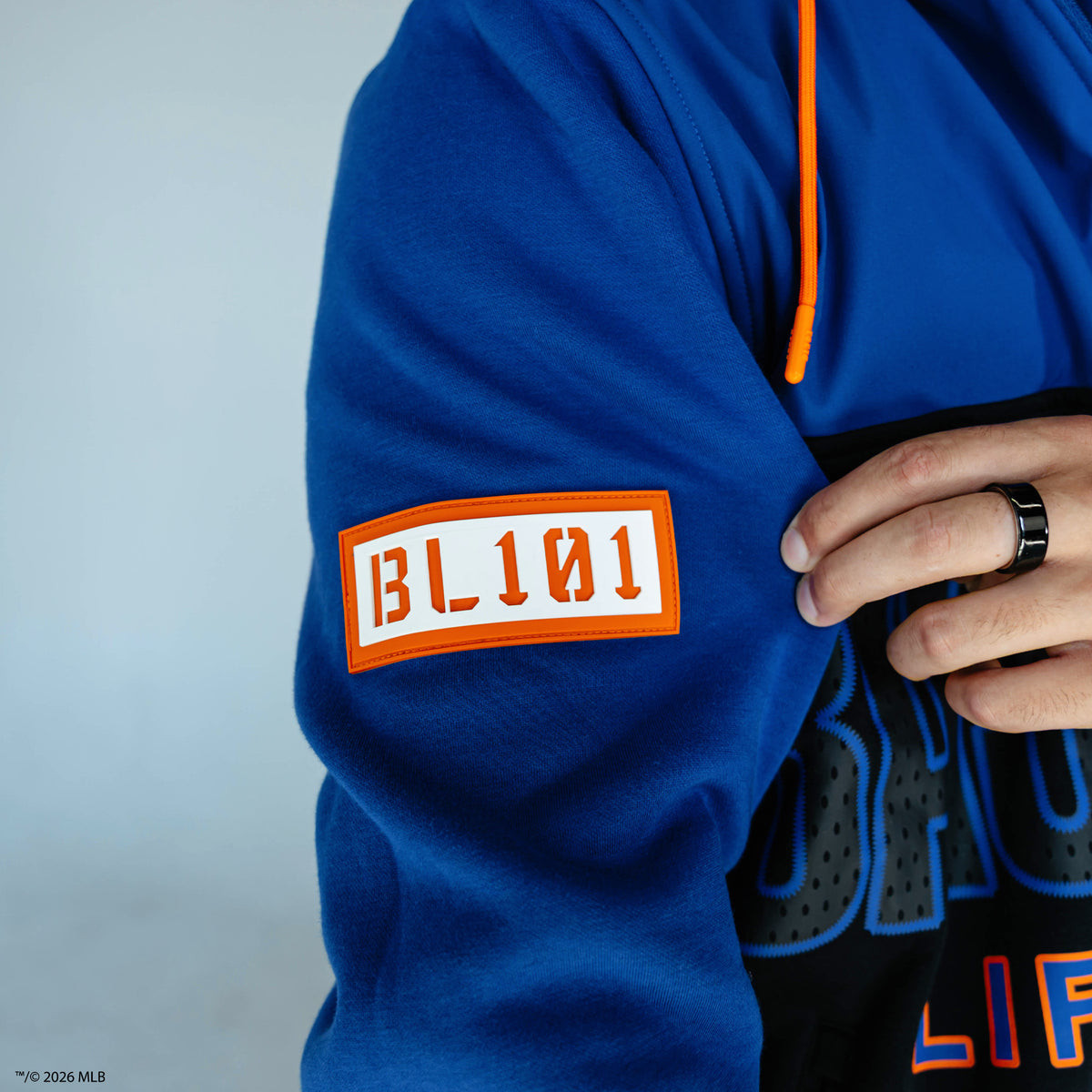 Adult model wearing blue New York Mets Color Block quarter zip