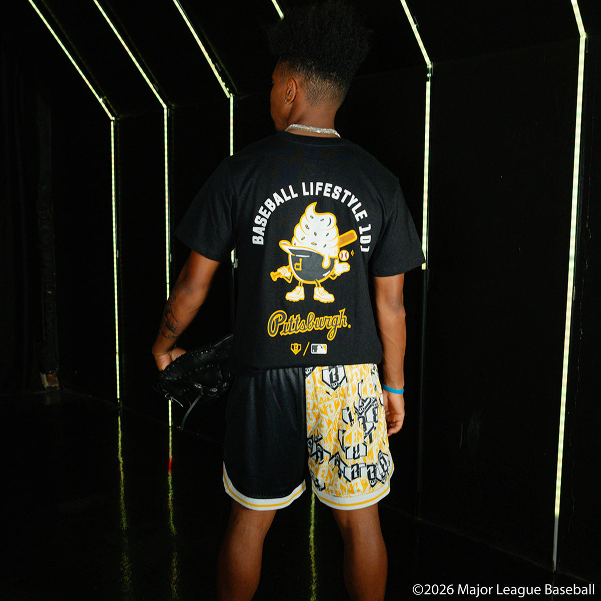 Adult model wearing black graphic tee with "Pittsburgh Pirates Ice Cream Cap" design