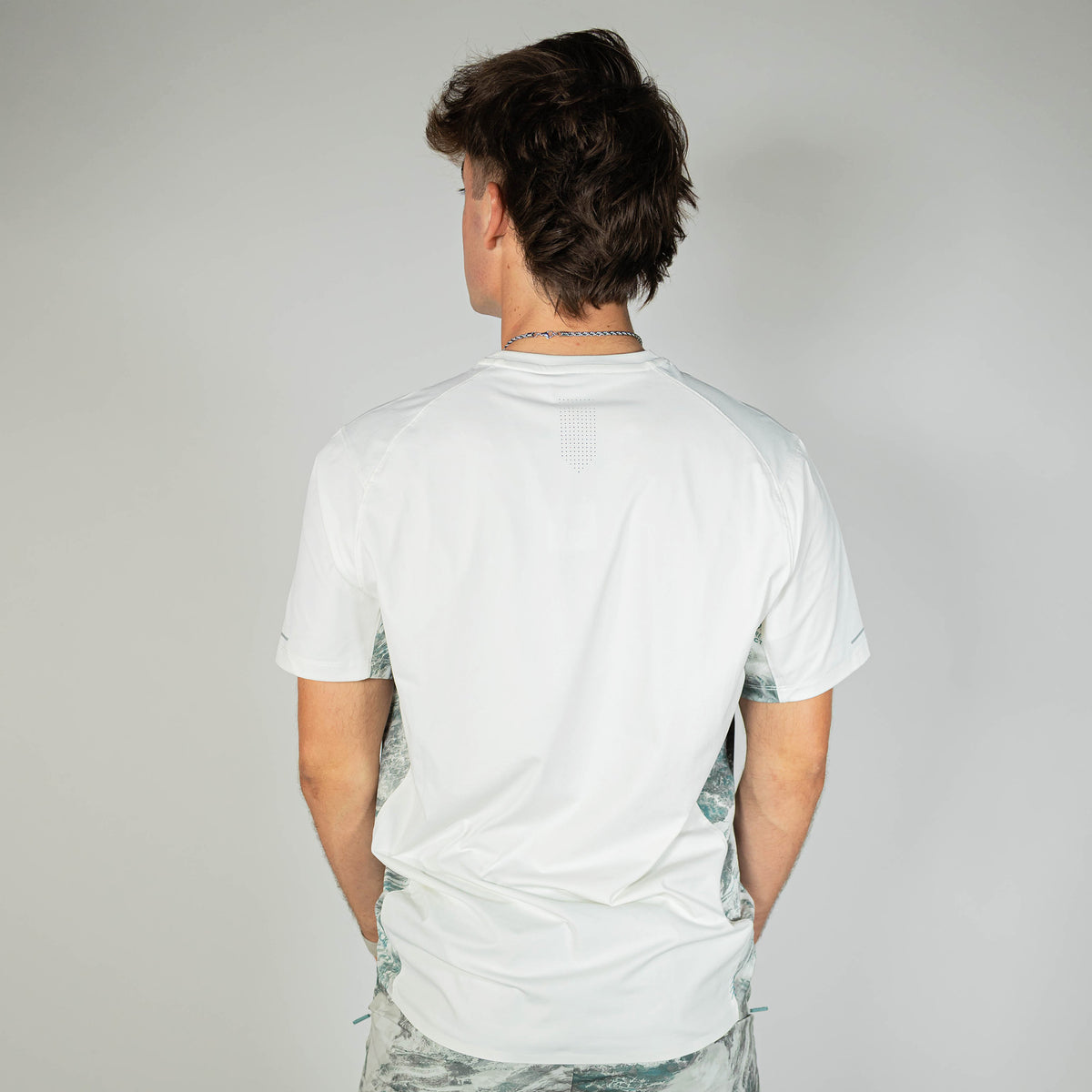 Adult model wearing white Realtree Aspect Diamond Tech Camo vented tee