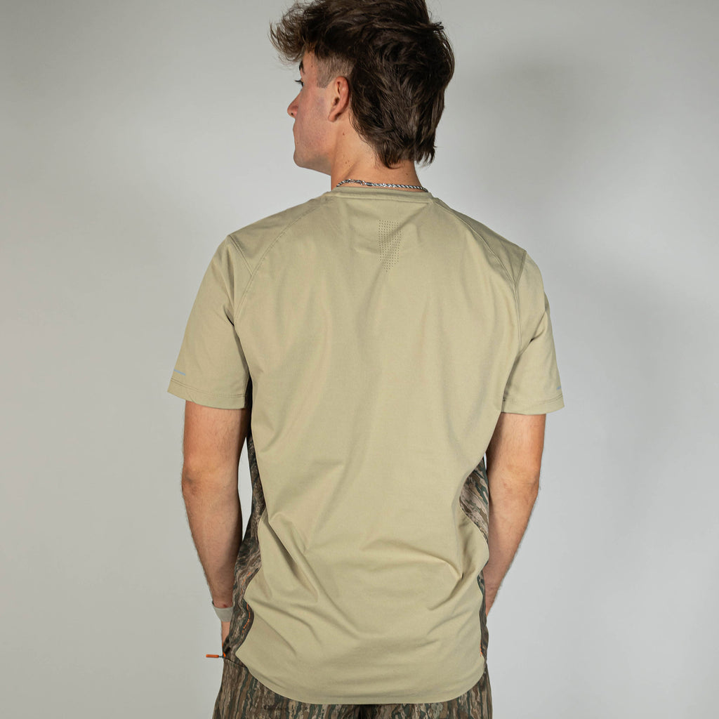 Adult model wearing brown Realtree Legacy Diamond Tech Camo vented tee