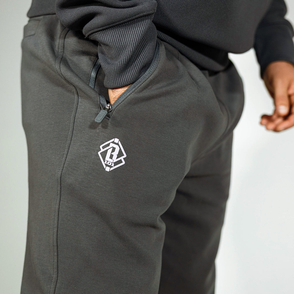 Adult model wearing gray and lilac Diamond Relaxed Fit joggers