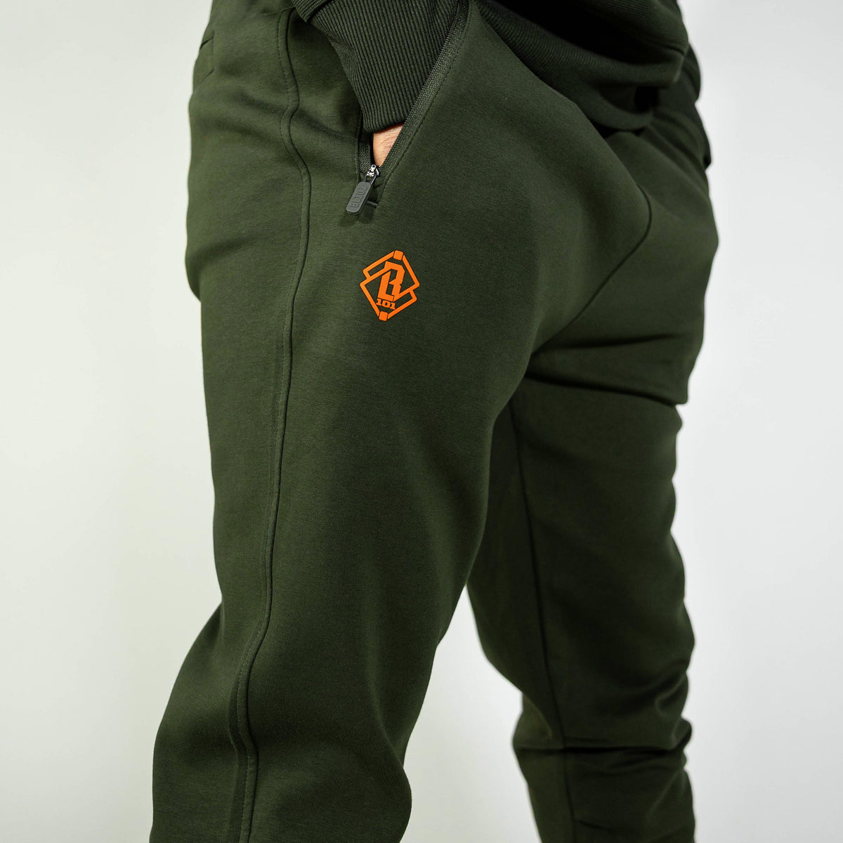 Adult model wearing green Realtree Legacy Diamond Relaxed Fit Camo joggers