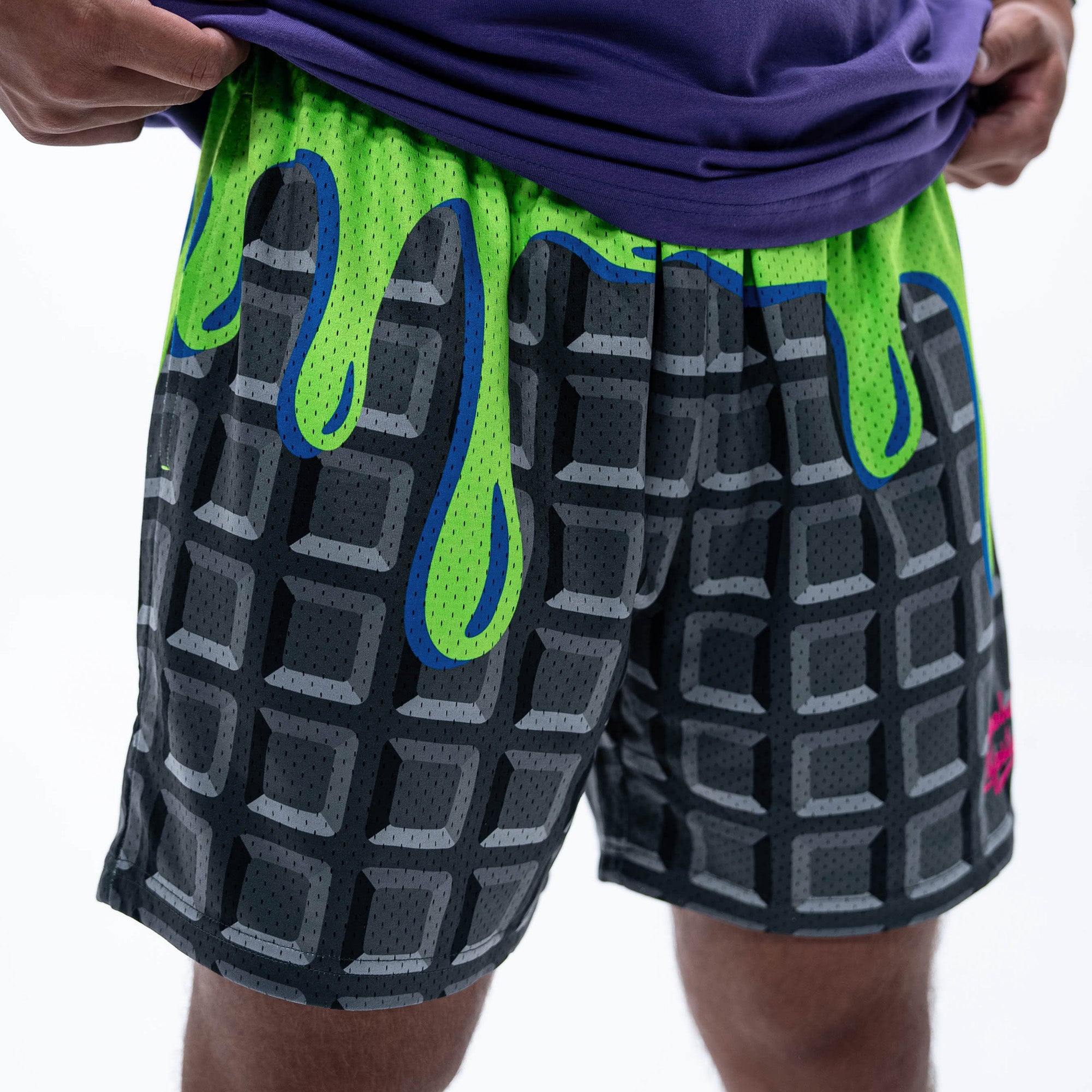 Adult model wearing black shorts with "Spooky SZN Waffle" design