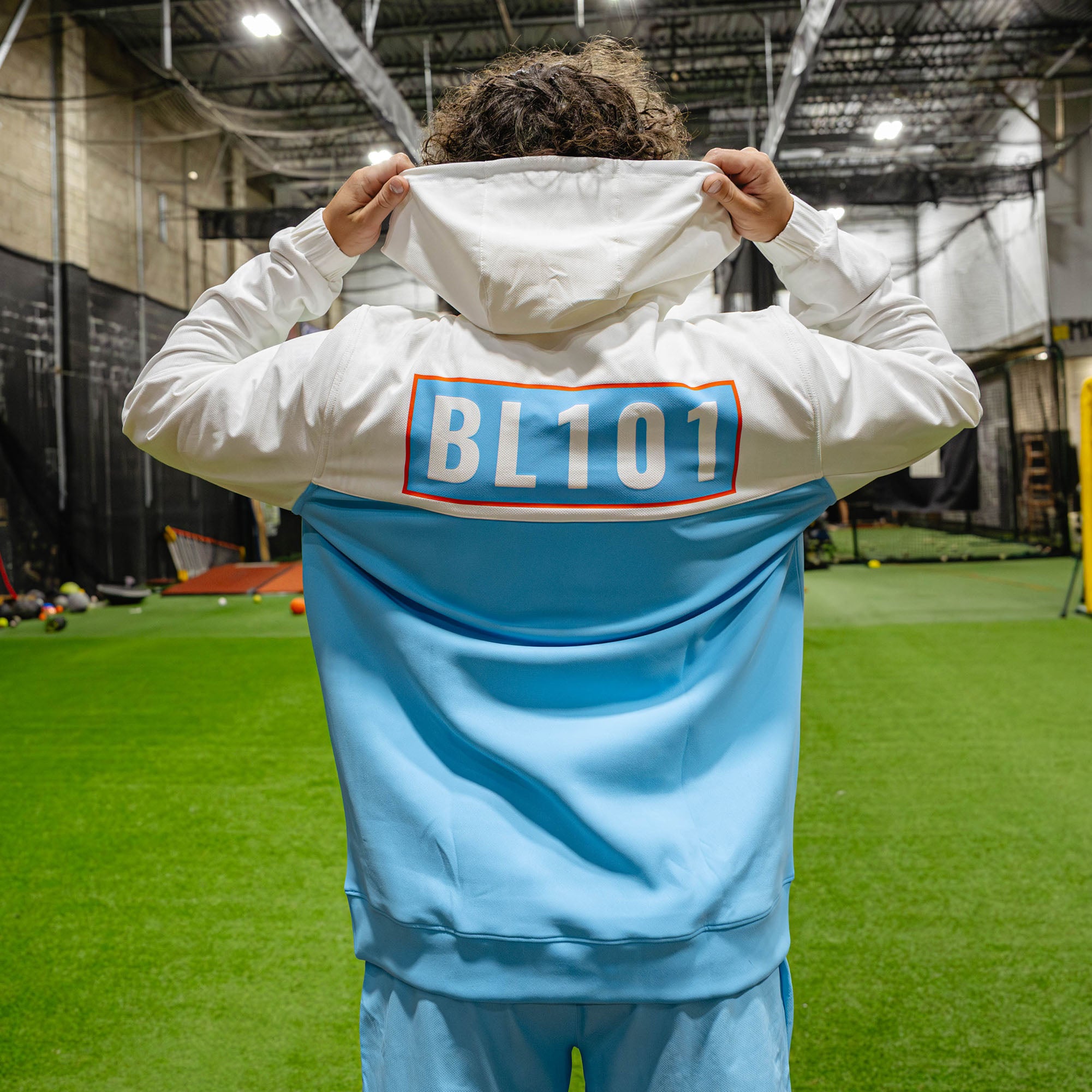 Adult model wearing multi-color hoodie with "UVChangeup Trash Talk" design