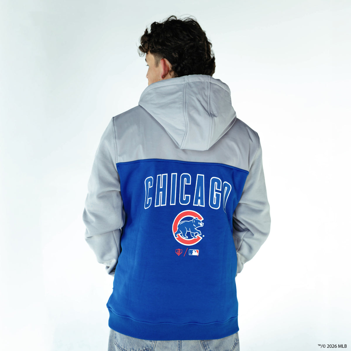 Adult model wearing blue Chicago Cubs Color Block quarter zip