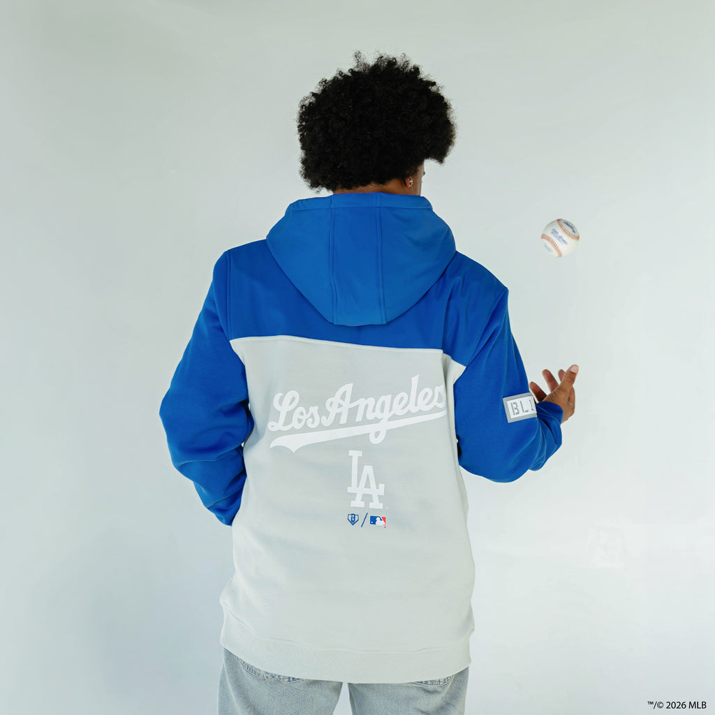 Adult model wearing blue Los Angeles Dodgers Color Block quarter zip
