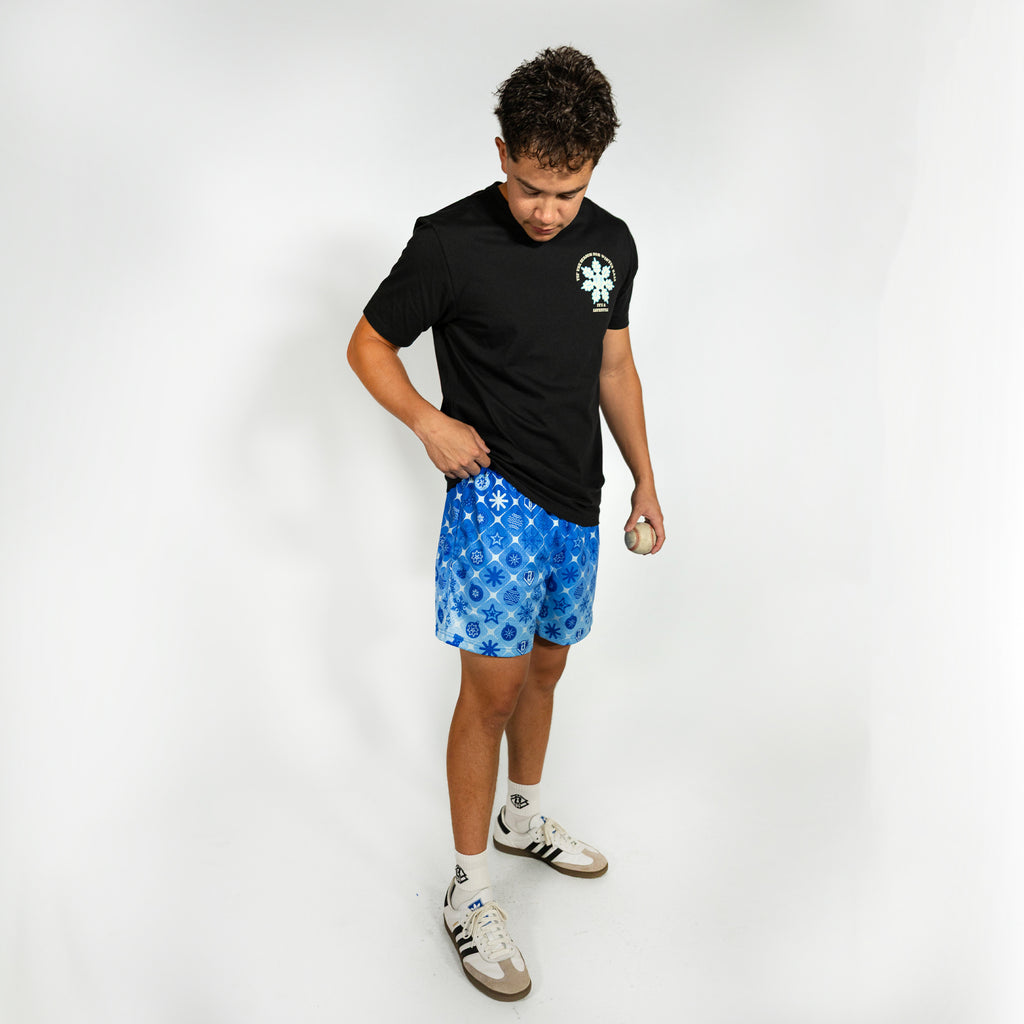 Adult model wearing blue shorts with "Frozen Diamond" design