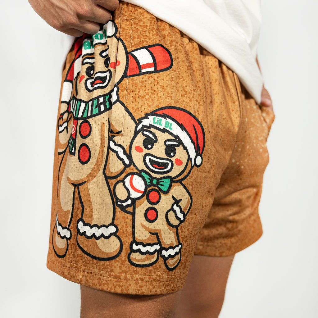 Adult model wearing brown shorts with "Gingerbread Rookie" design